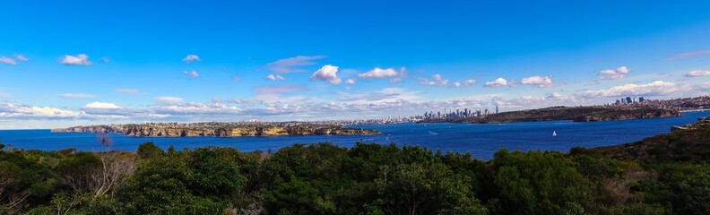 Naklejka na ściany i meble Panoramic view of Sydney Harbour in NSW Australia on a cold winters day Partly cloudy skies 