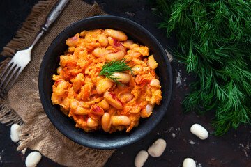 Stewed white beans with carrot in tomato sauce