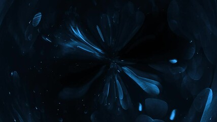 Blue paint drops mixing . dark blue abstract background. Magic ball