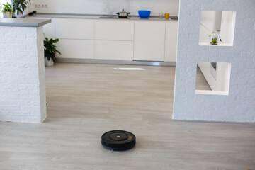 robotic vacuum cleaner on laminate wood floor smart cleaning technology