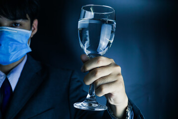 Businessman holding wine glass