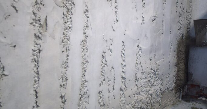 Applying plaster to the walls with the use of a plaster hopper bucket, 4k