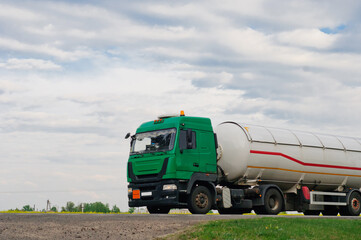 Obraz premium Truck with container on highway, cargo transportation concept. Shaving effect.