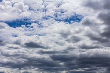 Obraz premium Grey rain clouds in the daytime. Bad weather. Grey clouds before a thunderstorm