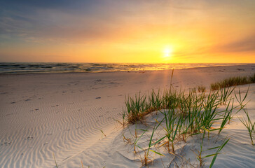 Beautiful summer sunset over beach at Baltic sea