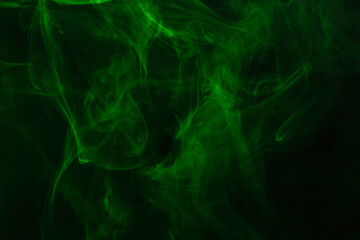 Green steam on a black background.