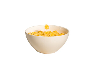 Corn flakes falling to the white bowl. Motion.
