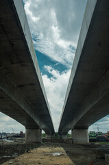 An image showing underneath an overhead bridge 
