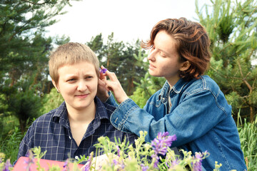 Cheerful young lesbian couple enjoying their time together outdoors