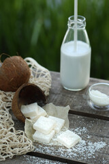 Fototapeta na wymiar Coconut marmalade in coconut, coconut milk in a bottle. 