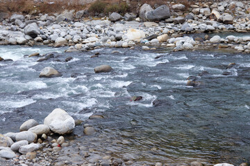 flowing river having rocks in the river