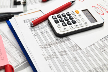Top view of office employee's desk - work with financial reports, analysis and accounting, tables and graphs, various office items for bookkeeping