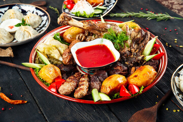 Assorted meat and potatoes on a traditional plate