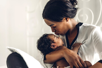 Portrait of enjoy happy love family african american mother playing with adorable little african...