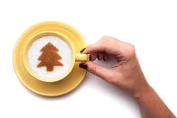 Top view of a cup of coffee with cream decorated. Food art creative concept image, drawing with cinnamon powder over white background.