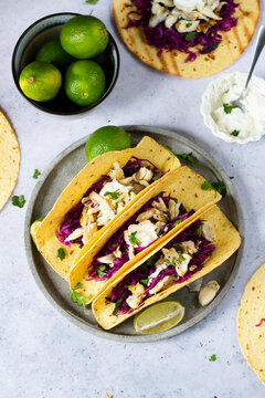 Fish Tacos With Red Cabbage Salsa And Fresh Lime On Side, Top View Of A Traditional Mexican Street Food, Homemade With Marinated Fish In Lime And Mexican Crema 