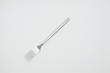 stainless fork in a white background