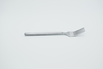 stainless fork in a white background