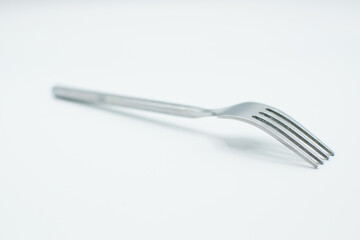 stainless fork in a white background