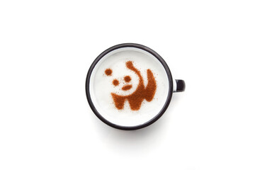 Fototapeta na wymiar A retro cup with coffee cream. Food art creative concept image, cute drawing with cinnamon powder over milk cream on a white background.