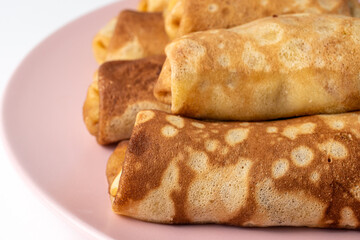 Wheat flour pancakes with strawberries. Sweet homemade pastries for breakfast. With sugar.