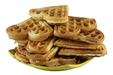 Freshly baked homemade waffles on a yellow plate isolated on white background