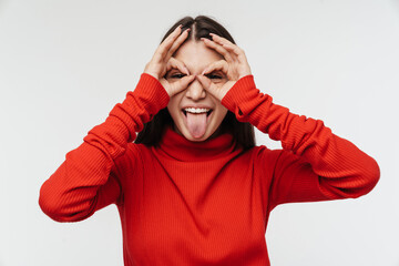 Photo of woman making fun with fingers and sticking out her tongue