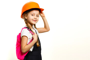Cute little girl is isolated on white background. Girl looking at camera, wearing yellow helmet