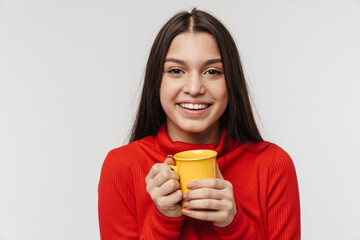 Photo of cheerful brunette woman laughing and holding cup