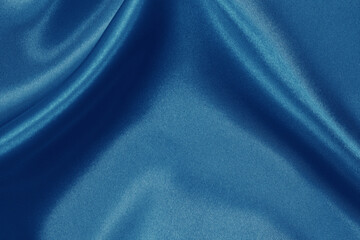 Blue fabric texture background, crumpled pattern of silk or linen.