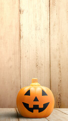 Jack-o-Lantern on wooden floor with wooden wall background