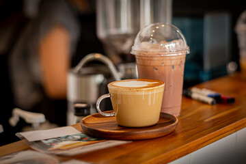 cup of cappuccino and chocolate, ready to serving on table.