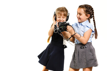 two little schoolgirls at recess. Children enjoy this recess. They smile fun.