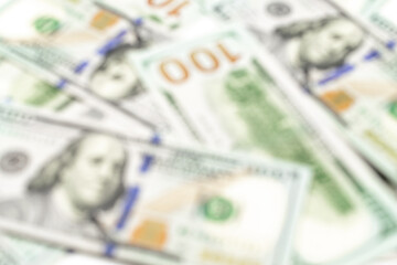 Us dollar abstract blur background. American USA money, 100 hundred paper cash in soft focus, usd bill.