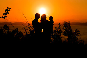 Fototapeta na wymiar Family and sunset