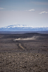 The mountain road Kjalvegur (Road F35), deep inside the central highlands of Iceland.  The gravel road lies through a pass between two large glaciers. 