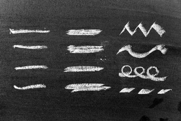 White color chalk hand drawing in set of line shape on black board background