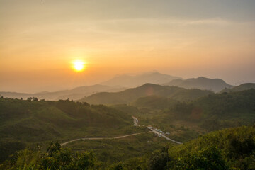 Fototapeta na wymiar Landscape sunrise with mountain in the pilok , Kanchanaburi , Thailand