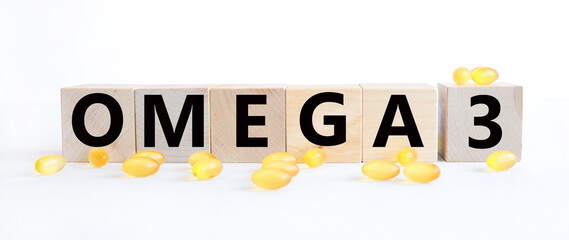 Omega capsules with cubes on white background. Concept healthy nutrition. 3D rendering