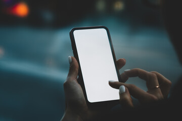 Cropped back view of modern smartphone with blank screen area for your internet content or...