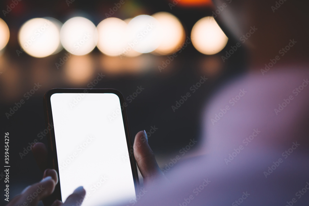 Poster cropped view of female hands holding smartphone with mock up area for your internet content or websi