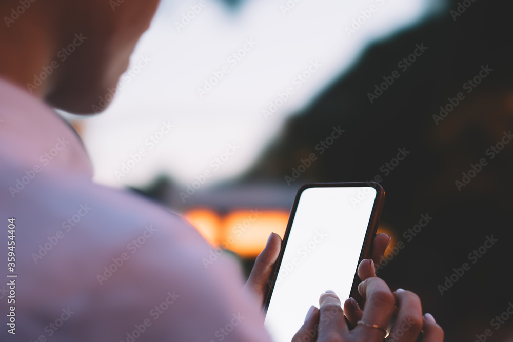 Poster cropped view of female finger typing on blank display of smartphone with copy space area for your in