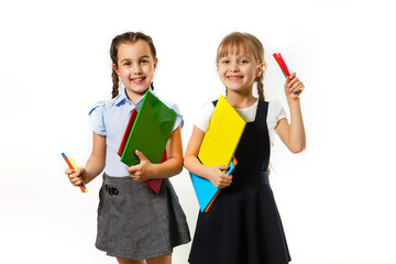Portrait of two people nice cute lovely charming dreamy attractive cheerful pre-teen girls siblings showing aside ad promotion copy space isolated background