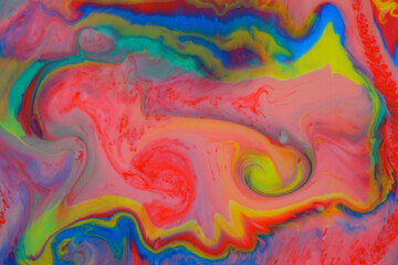 Abstract psychedelic background. Movement of ink in a multicolored liquid
