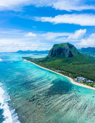 Aerial panoramic view of Mauritius island - Detail of Le Morne Brabant mountain with underwater waterfall perspective optic illusion - Wanderlust and travel concept with nature wonders on vivid filter