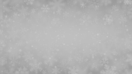 Christmas background of snowflakes of different shapes, sizes, blur and transparency in gray colors