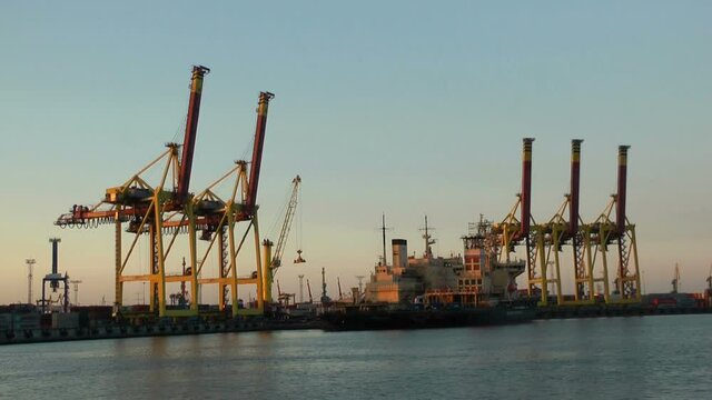 Russia, Saint Petersburg, June 19, 2020: Seaport, cranes, ships and containers. Marine cargo transportation industry.