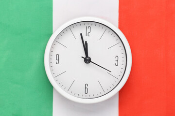 White clock on background of Italy flag