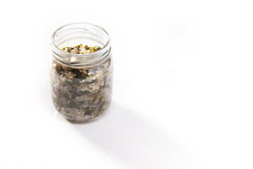 Nutrition concept - Healthy food, Diet, Detox, Clean Eating or Vegetarian concept. A nutritious food on glass jars against white background. Delicious salad in a glass jar. 