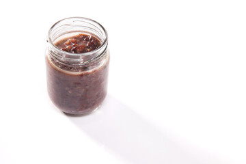 Nutrition concept - Healthy food, Diet, Detox, Clean Eating or Vegetarian concept. A nutritious food on glass jars against white background.